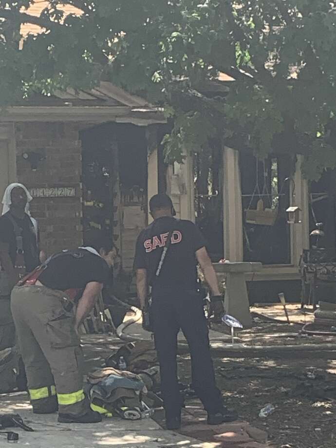 San Antonio firefighters rescued six animals from a burning home on the North Side on Thursday. Photo: Taylor Pettaway