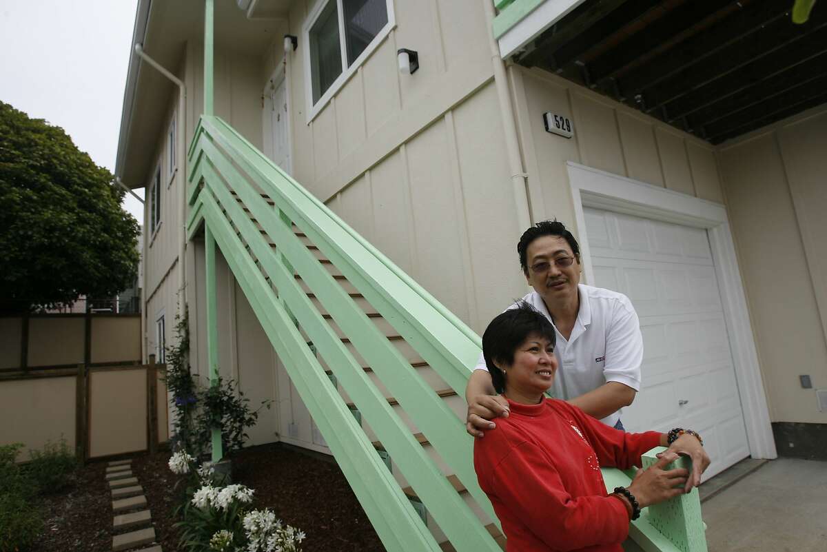 Ben Ong and Virginia Tan in front of their Habitat for Humanity home in Daly City in 2006. The Bay Area chapter of the organization is lobbying for SB899, a bill that would allow faith groups to build affordable housing on their own property with a streamlined approval process.