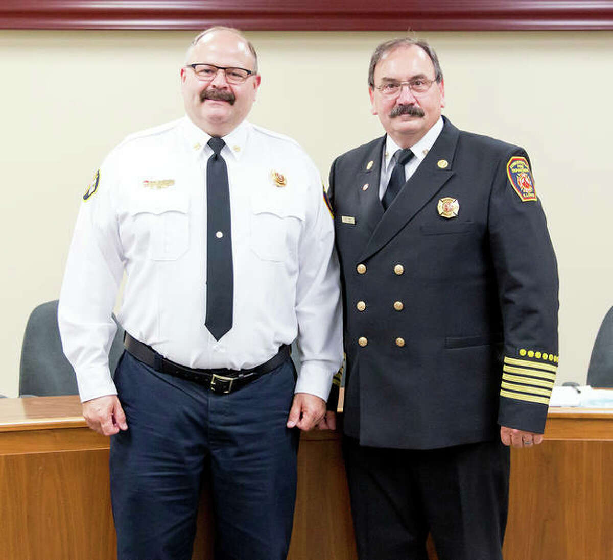 Dep. Fire Chief James Whiteford, left, will become the city’s new fire chief Monday as he succeeds Fire Chief Rick Welle, right.
