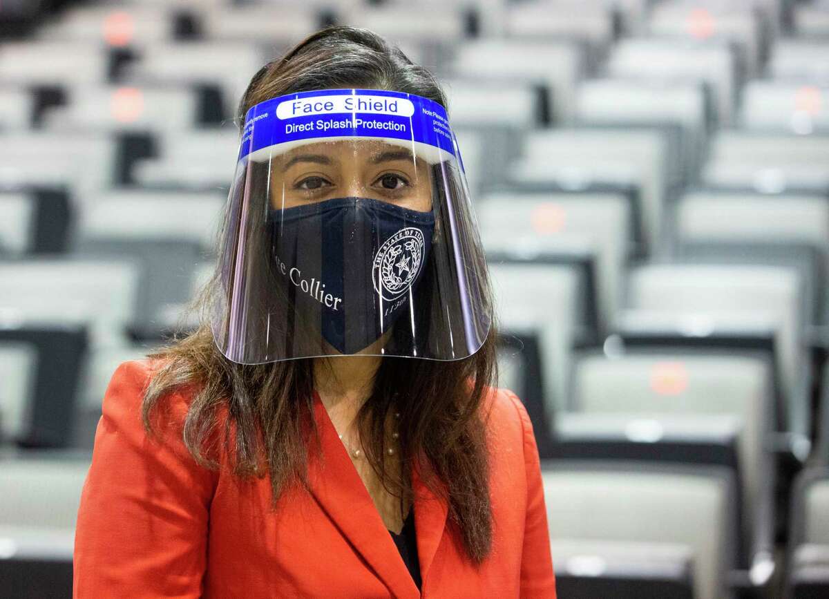 Harris County 113th District Court Judge Rabeea Collier poses for a photograph with a face shield at grand jury voir dire room that is set up during the coronavirus pandemic Monday, July 6, 2020, at NRG Arena in Houston. Each juror will receive a face shield and they will be sitting in designated seats that follow the social distancing rules, which is every other row and three seats apart.