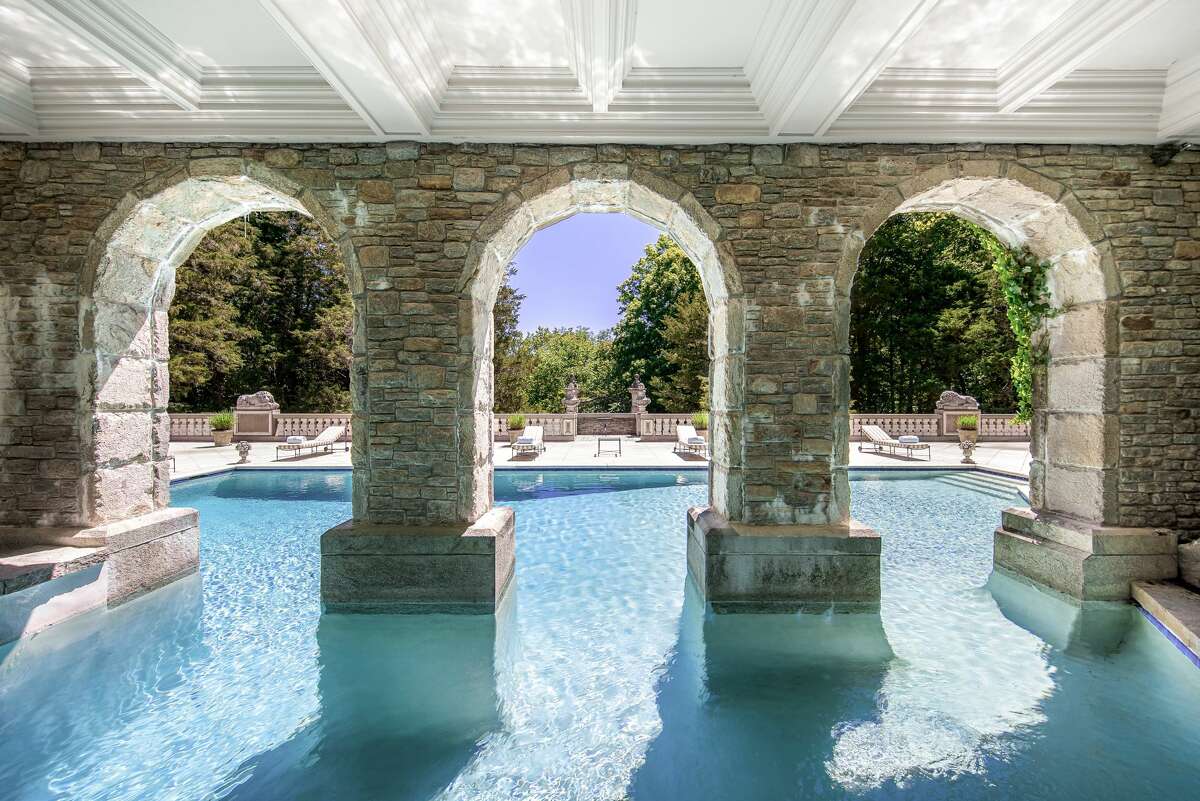 The property located at 32 Chateau Ridge Road in the Round Hill section of Greenwich is up for auction via Concierge Auctions. The 16,301-square-foot house was built in 1927 and was renovated in the 1980s. It has 13 bedrooms, 18 bathrooms and sits on 4.6 acres of land. The property features a tennis court and tennis house, a swimming pool, grotto and pool house with two bathrooms as well as covered terraces, according to the auction site.  
