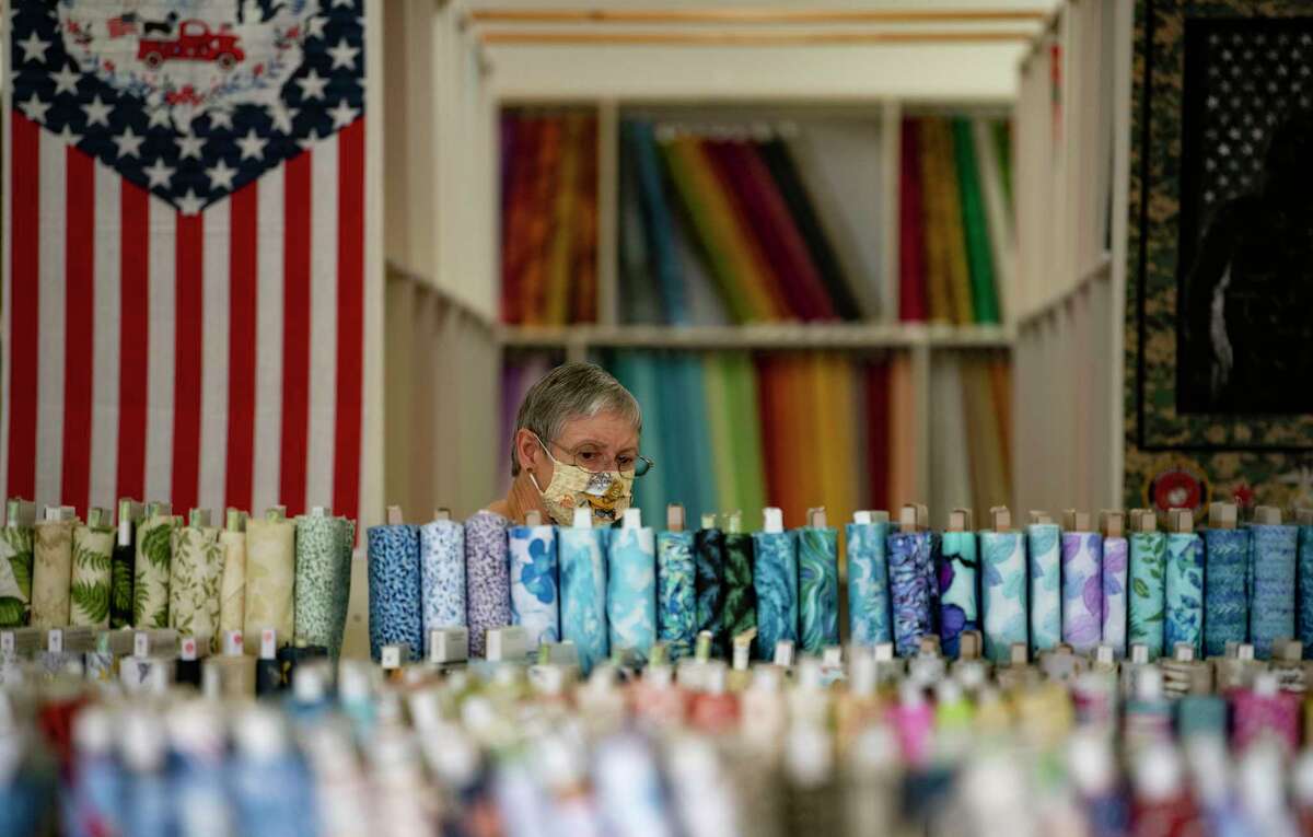 April Rippel of Seguin, who has sewn over 3,000 masks during the coronavirus pandemic, shops for cloth at Allbrands.com Creative Sewing Center. Like bicycles, home exercise equipment and televisions, sewing machines have become hard-to-find pandemic must-haves.
