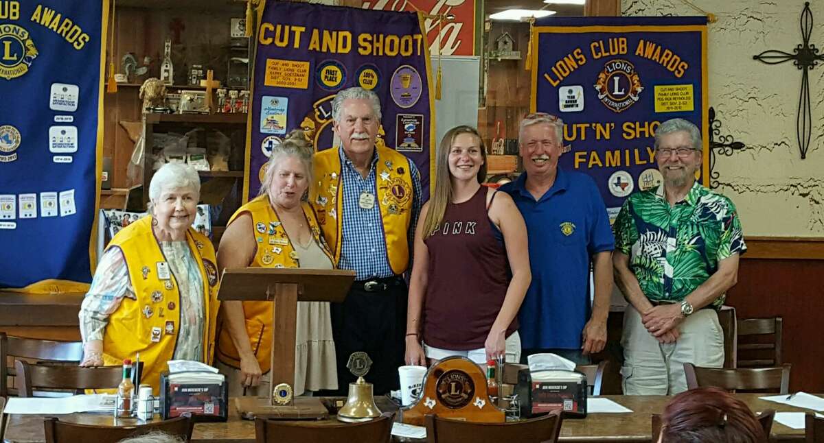 Past District Governor Pat Brennan of the Conroe Noon Lions Club installed new officers Thursday night for the Cut & Shoot Family Lions Club. Becky Judah, left, is the new club president.