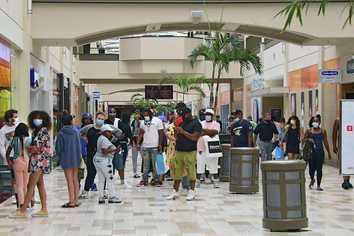 A line is formed outside of the Jimmy Jazz store as Crossgates Mall reopened public spaces on Friday July 10, 2020 in Guilderland, N.Y. Local malls can open their interior public spaces after the governor gave the go-ahead if the HVAC system meets certain standards for filtering out Covid-19.