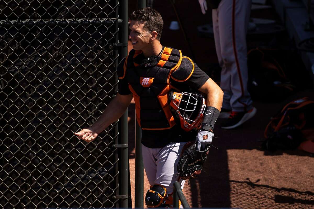 Buster Posey #28 of the San Francisco Giants walks in the outfield during summer training camp at Oracle Park in San Francisco, Calif. on Monday, July 6, 2020.