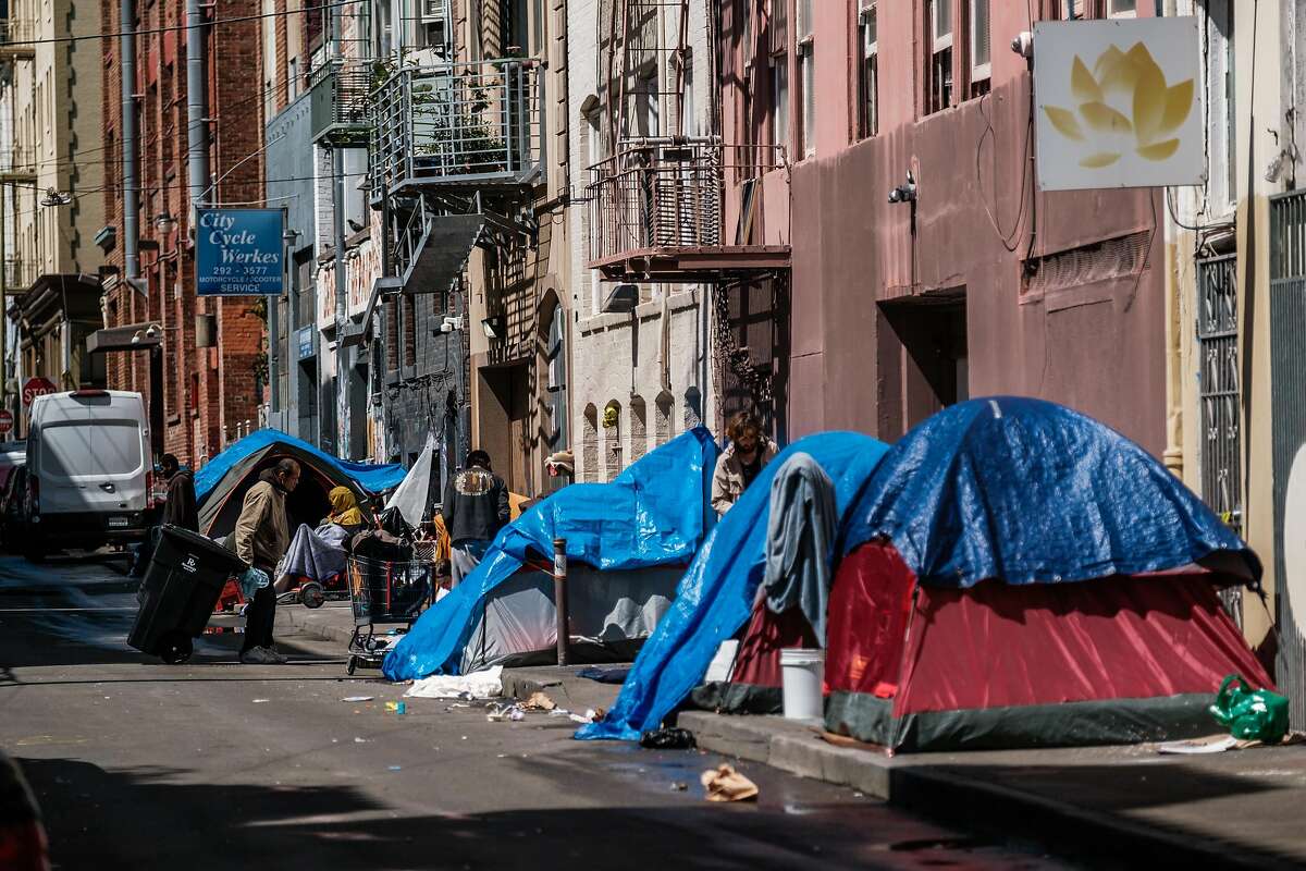 A row of homeless tents are seen in an alley way in the Tenderloin in San Francisco, Calif. on Tuesday April 7, 2020.