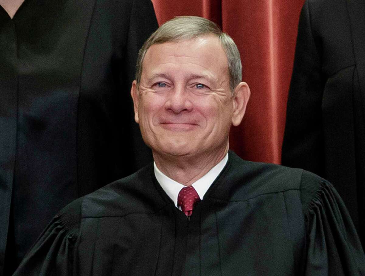 FILE - This Nov. 30, 2018, file photo shows Chief Justice of the United States, John Roberts, as he sits with fellow Supreme Court justices for a group portrait at the Supreme Court Building in Washington. Roberts spent the night in the hospital in June 2020 after he fell and injured his forehead, a Supreme Court spokeswoman confirmed Tuesday, July 7. (AP Photo/J. Scott Applewhite, File)
