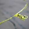 Police tape is seen as crime scene technicians investigate a crashed vehicle outside a CVS Pharmacy, in Hayward, Calif, on Monday, June 1, 2020, where Hayward police allegedly shot a male suspect while responding to reports of looting in the early morning hours.