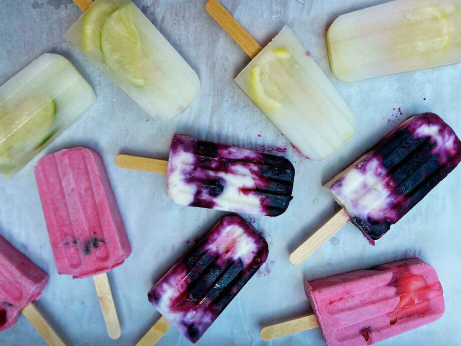 Use purees of fruit, cream, yogurt or simply juice and herbs to make these pretty homemade popsicles. (Jamila Robinson/The Philadelphia Inquirer/TNS) / The Philadelphia Inquirer