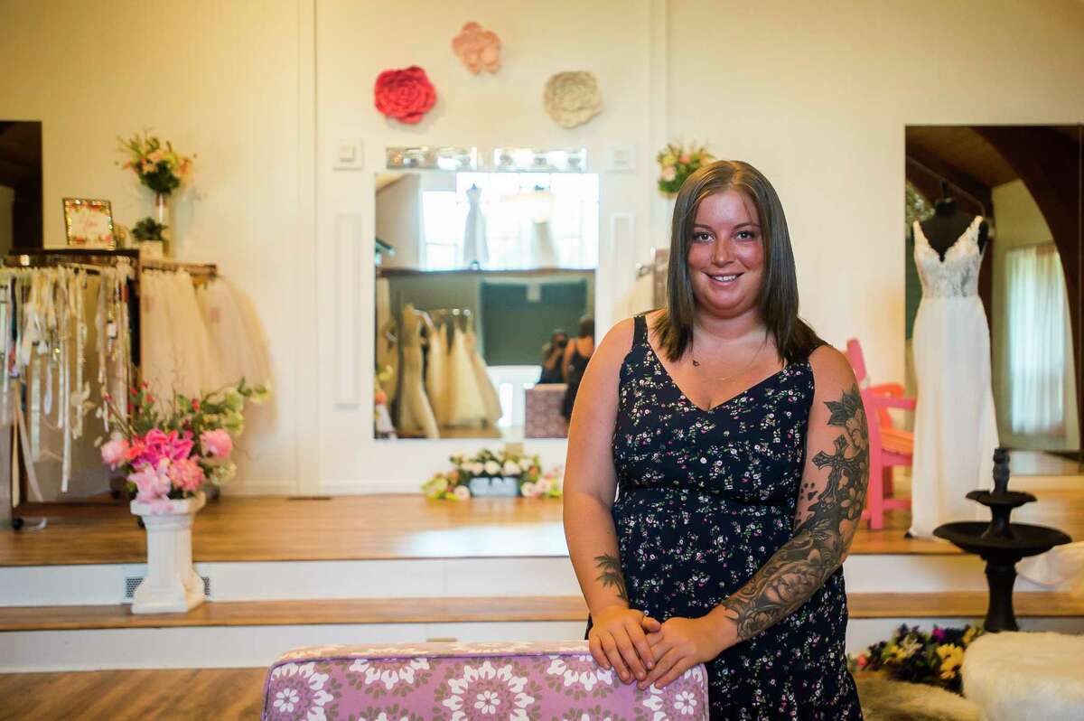 Three Diamonds Bridal owner Hannah Merillat poses for a portrait Thursday inside the store at 230 W. Saginaw Road in Sanford. The shop is the first among downtown Sanford businesses to reopen after flooding devastated the area in mid-May.(Katy Kildee/kkildee@mdn.net)