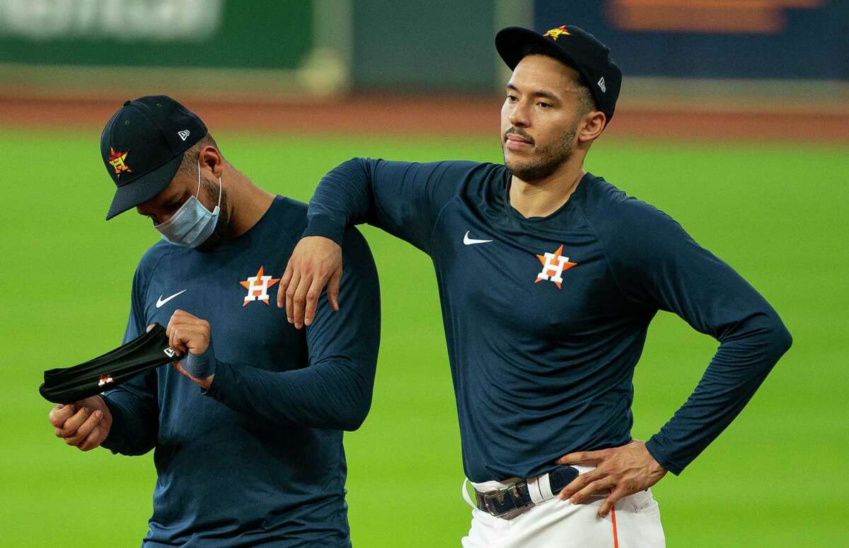 Astros first baseman Yuli Gurriel, left, and shortstop Carlos Correa fell short to a pair of Mariners in the defensive metrics used to determine this year’s Gold Glove winners.