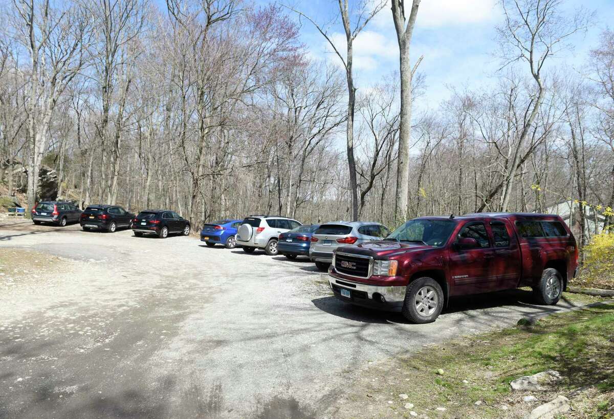 Cars are parked at the entrance of the Greenwich-owned section of Mianus River Park on Wednesday, April 1, 2020.