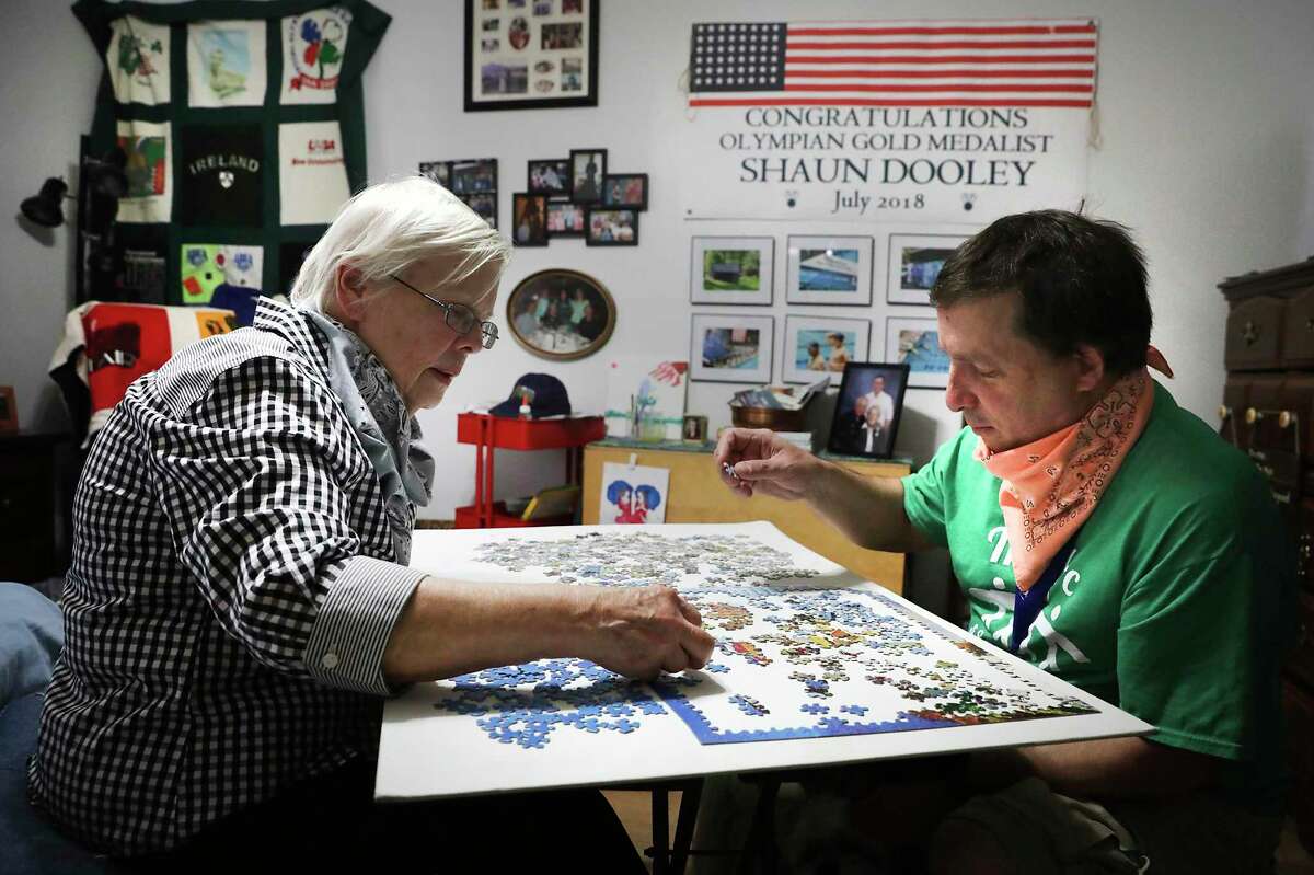 Shaun Dooley, a participant in the ARC's Adult Life Enrichment program, has found great satisfaction and meaningful relationships at the ARC, on Friday, May 22, 2020. Shaun, right, enjoys putting together jigsaw puzzles with his mother Toni, left.