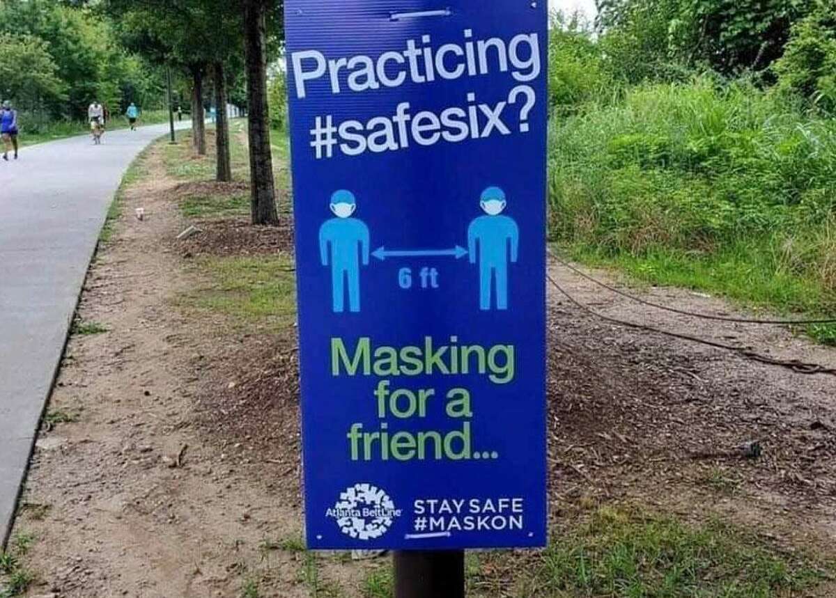 Signs such as this one from Atlanta, Ga, offer advice to prevent the spread of the coronavirus.