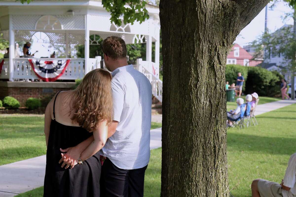 Newlyweds Matthew and Julianne Furniss-Green of Fairfield, who were just married on June 20, enjoy a moment together at this season's first Sherman Green Summer Concert on Saturday, July 11, 2020, in Fairfield, Conn. Matthew and Julianne Furniss-Green of Fairfield - a self-described
