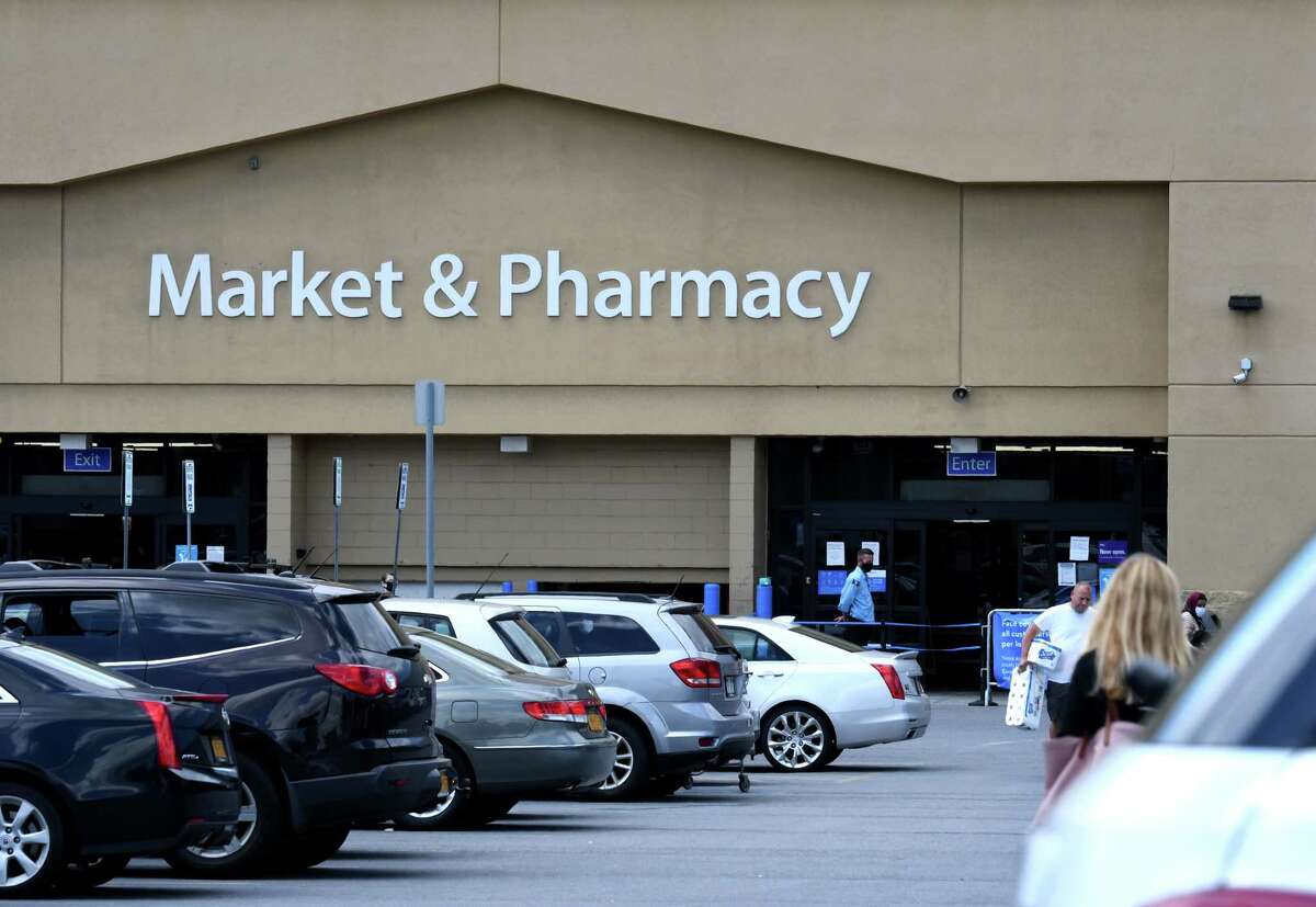 Customers shopping at Glenmont Walmart in Bethlehem, New York A Troy man has pleaded guilty to stealing six firearms from the store and pointing the guns at store employees in May 2022, prosecutors said.