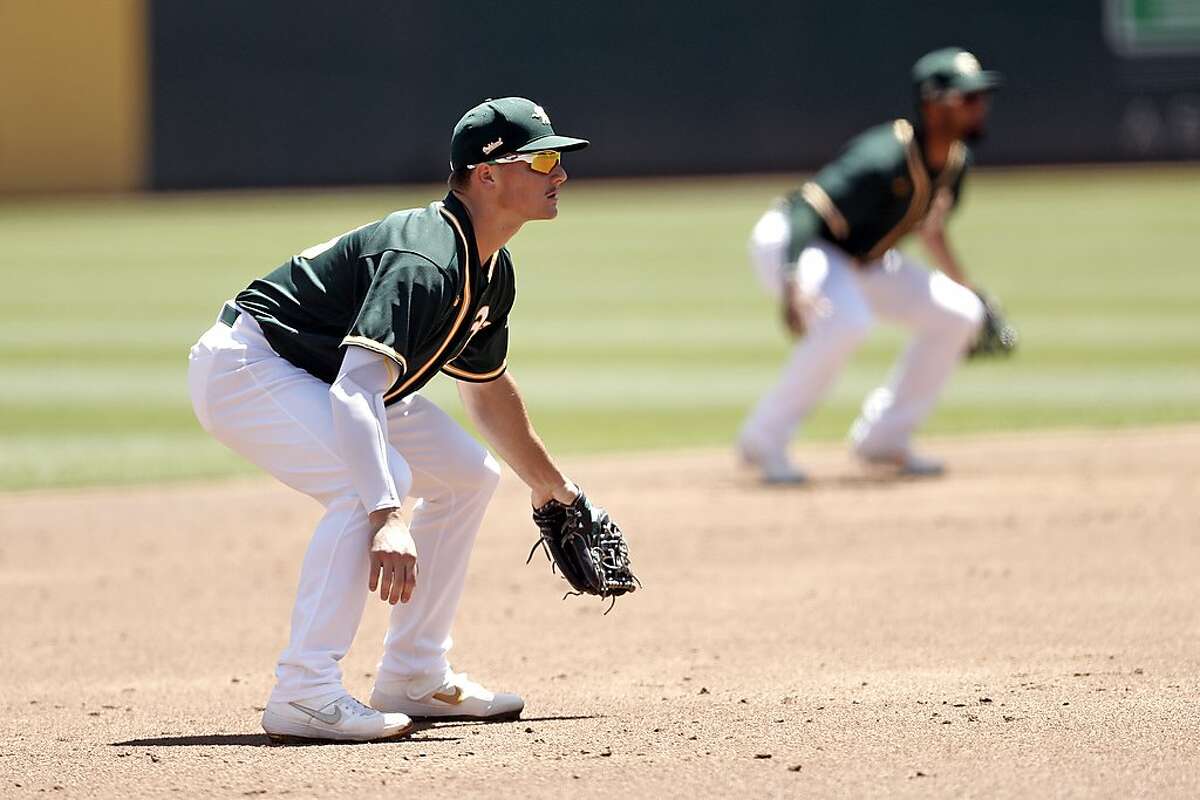 Oakland Athletics' Matt Chapman and Marcus Semien during simulated game at Oakland Coliseum in Oakland, Calif., on Sunday, July 12, 2020. Chapman told sportswriters that at the beginning of spring training 2021 he is feeling good and ready to play following offseason hip surgery.
