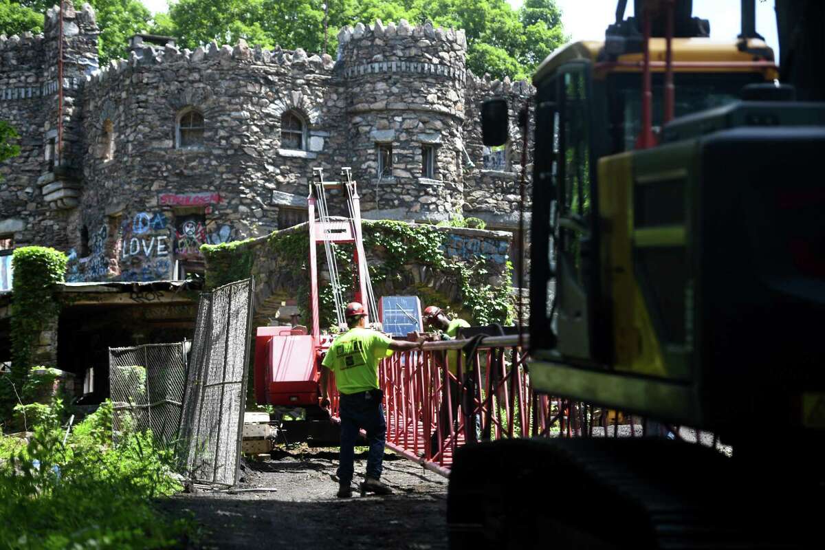 Work begins on abatement of the Hearthstone Castle historic site on Brushy Hill Road in Danbury, Conn. on Monday, July 13, 2020.
