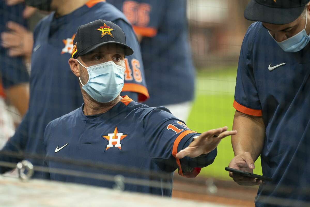 Houston Astros bench coach Joe Espada talks to the dugout during a simulated game, part of the team's summer camp workout, Monday, July 13, 2020, at Minute Maid Park in Houston.