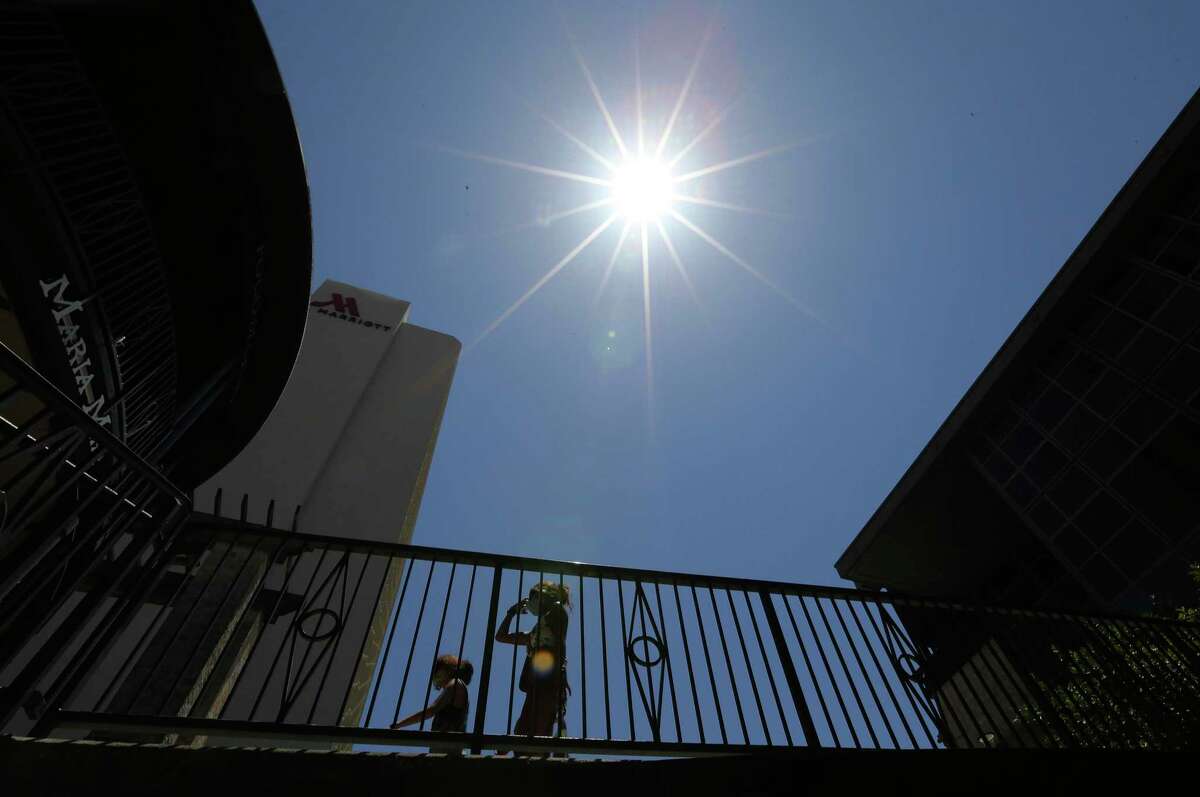 The sun was relentless at the Shops at Rivercenter on Monday, July 13, 2020, adding to the scorching heat.