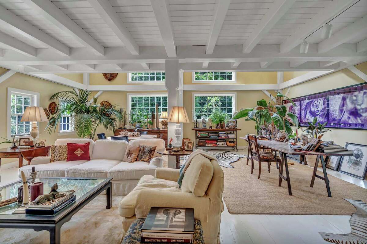 In the cavernous 725-square-foot, two-story living or great room there is a wood-burning stone fireplace and built-in shelving. For more information or to set up an appointment to see the house, contact Jane Jones of Berkshire Hathaway HomeServices New England Properties at 203-918-4751 or janejones@bhhsne.com.