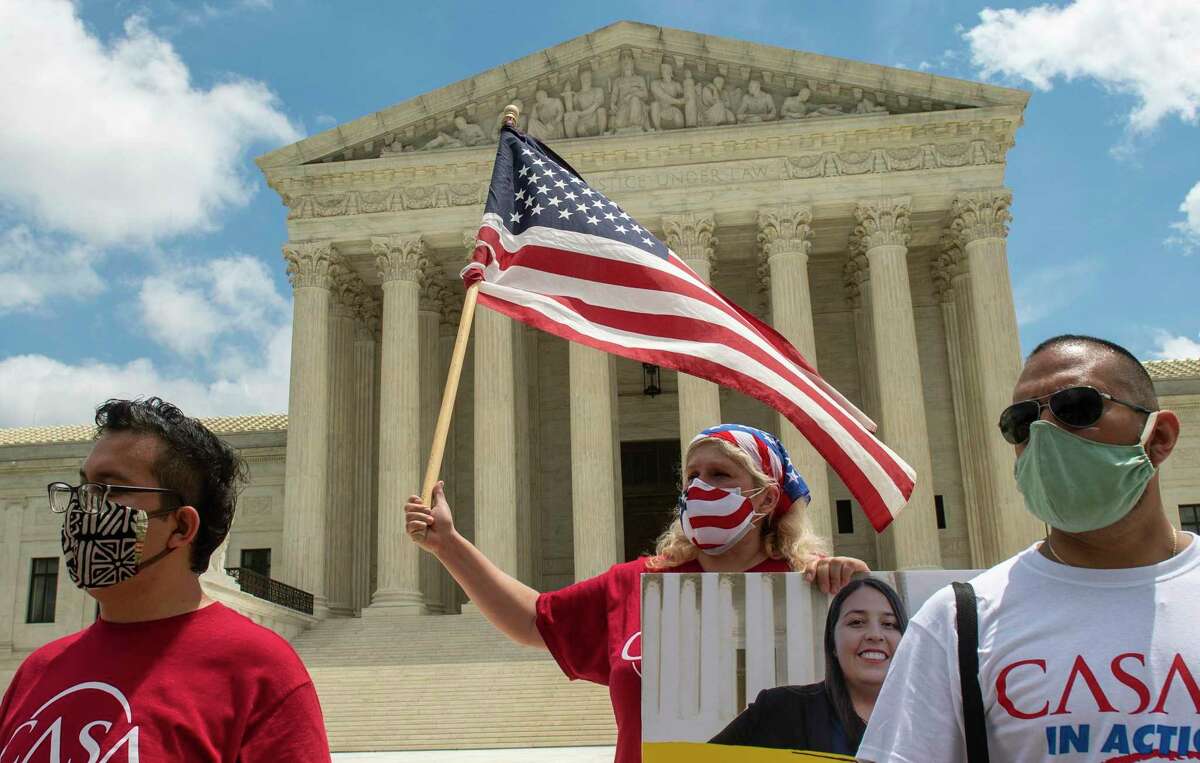 Advocates gather Thursday as the Supreme Court rejected an attempt to dismantle DACA.