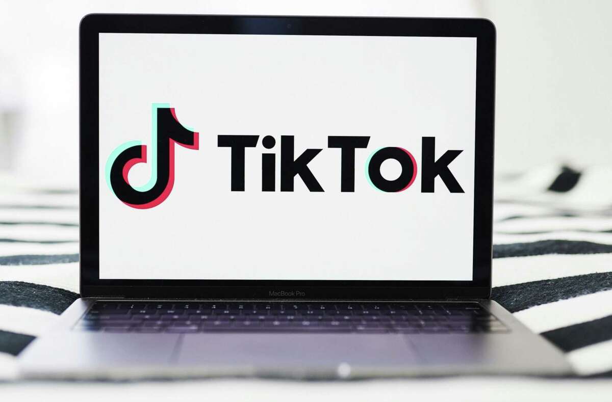 Signage for ByteDance Ltd.'s TikTok app is displayed on a laptop computer.