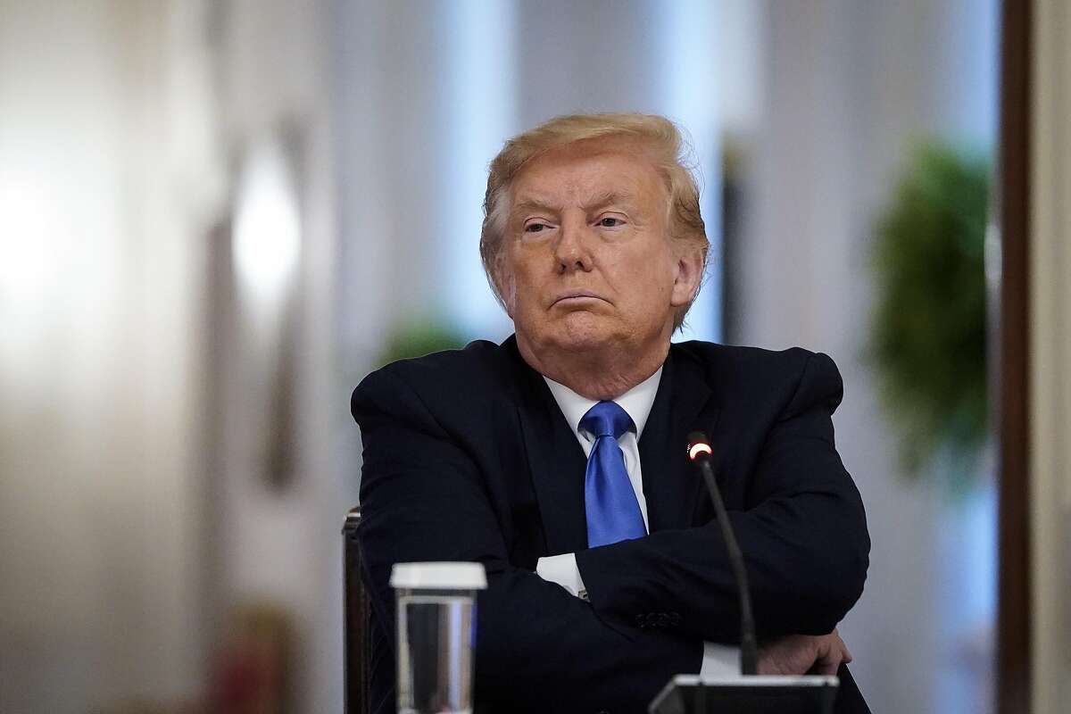WASHINGTON, DC - JULY 13: U.S. President Donald Trump listens during an event about citizens positively impacted by law enforcement, in the East Room of the White House on July 13, 2020 in Washington, DC. The president highlighted life-saving actions by l