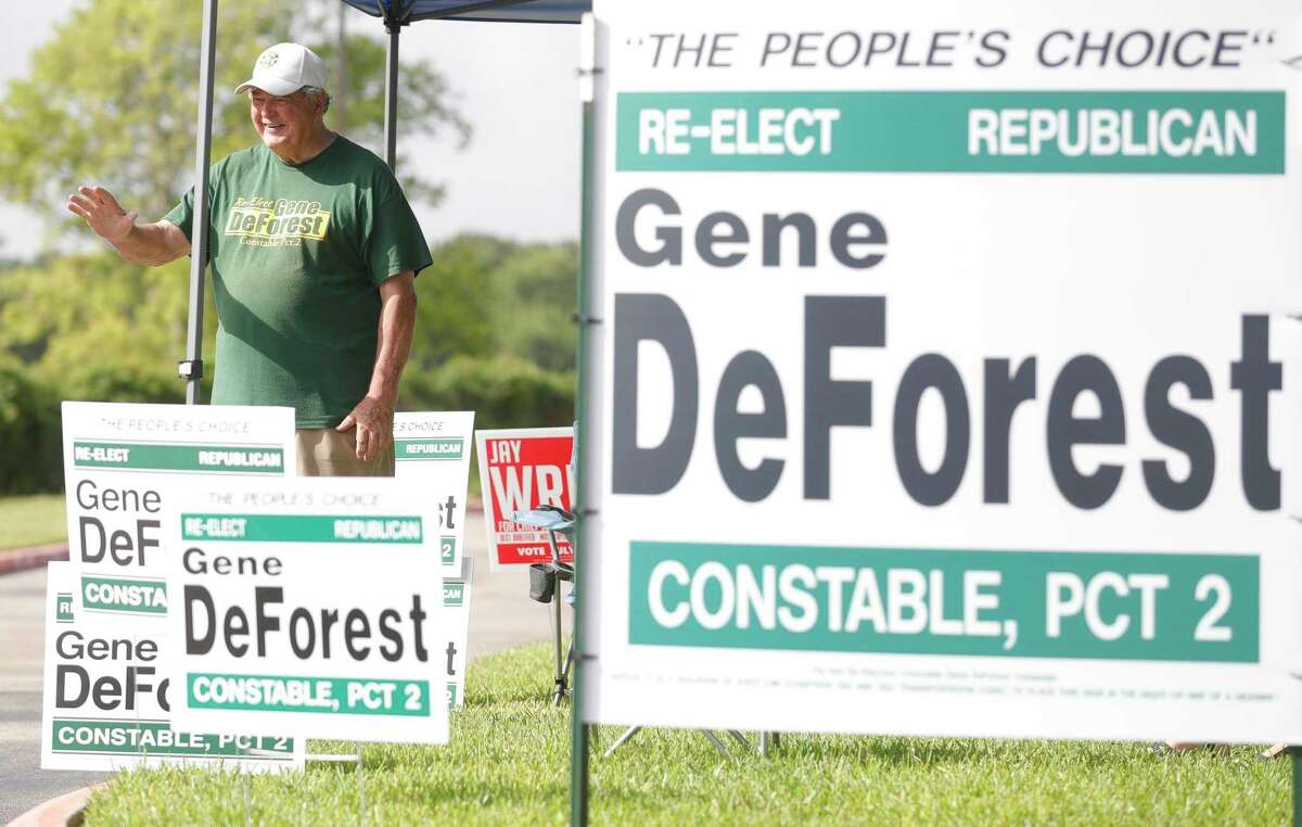 Incumbent Montgomery County Precinct 2 Constable Gene DeForest waves to voters.