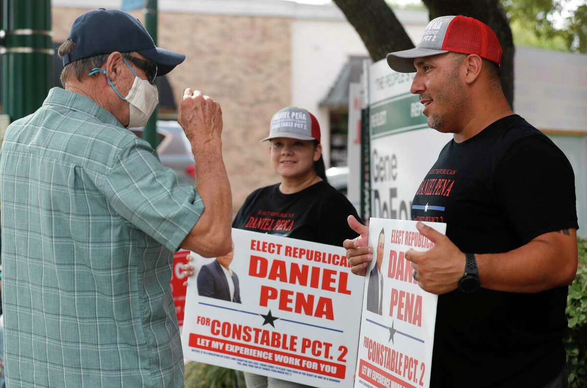 Daniel Pena, a candidate for Montgomery County Precinct 2 Constable, campaigns on the final day of early voting for the run-off election against incumbent Gene DeForest, Thursday, July 9, 2020, in Conroe.