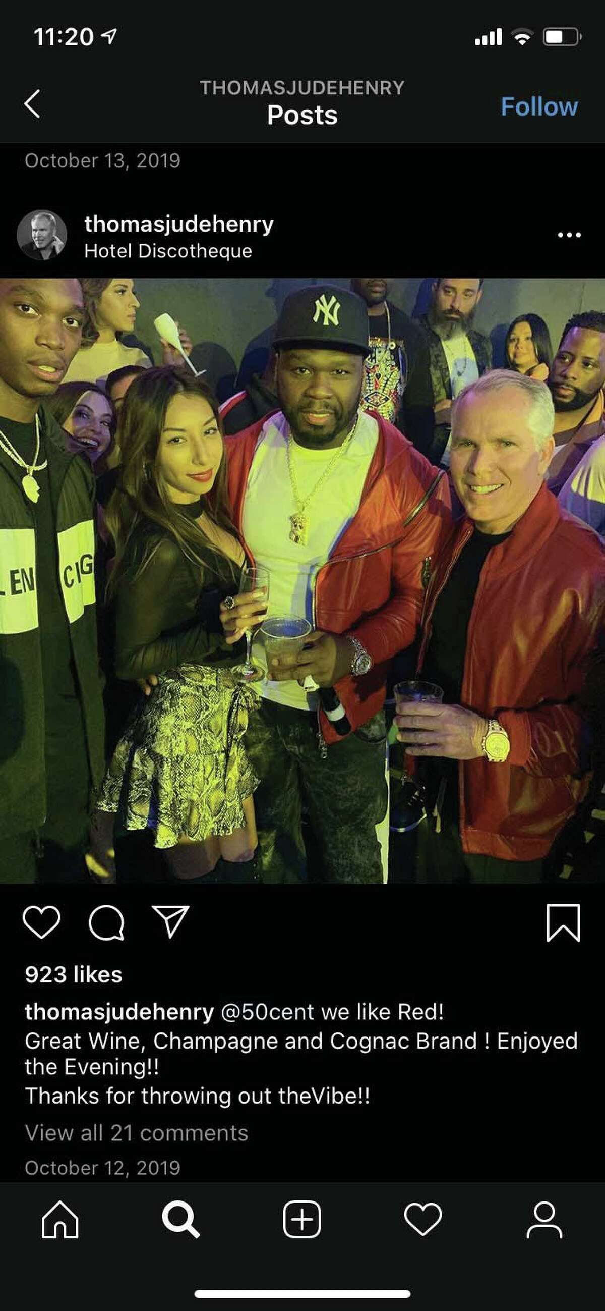 Thomas J. Henry and Evelin Crossland flank rapper 50 Cent in an image from Henry’s Instagram account. The image was a part of a court exhibit filed June 29 in litigation unfolding in San Antonio.