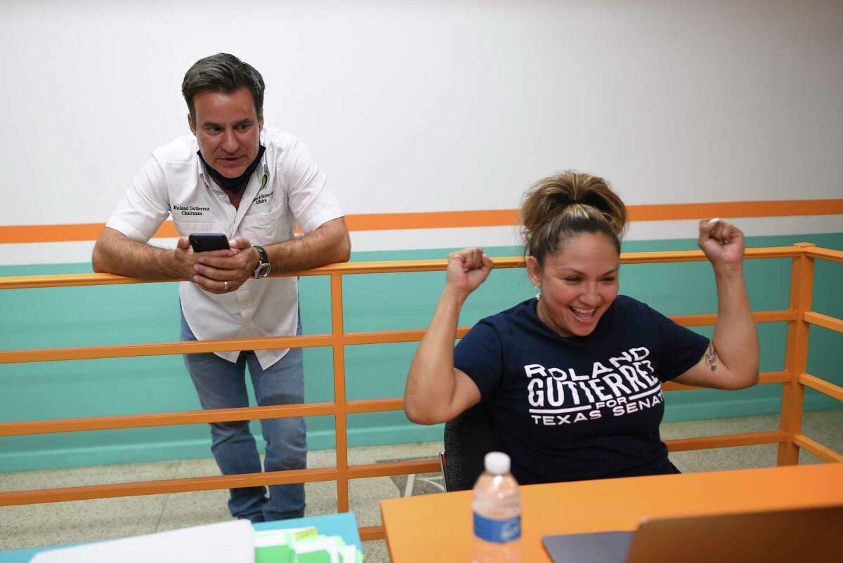 State Rep. Roland Gutierrez and campaign worker Leticia Cantu monitor elections results Tuesday. He was leading Xochil Peña Rodriguez for the Texas Senate District 19. Democratic nomination.
