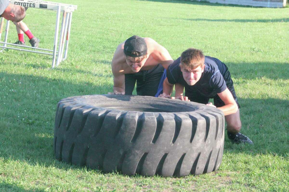 Pushing and pulling tires remains a key component of Reed City football conditioning. (Herald Review file photo)