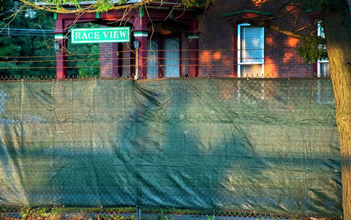 Exercise rider?•s shadows are captured on the new privacy fence in stalled on the Nelson Avenue side of the main track the day before opening day at Saratoga Race Course July 15, 2020 in Saratoga Springs, N.Y. Photo by Skip Dickstein/Special to the Times Union.