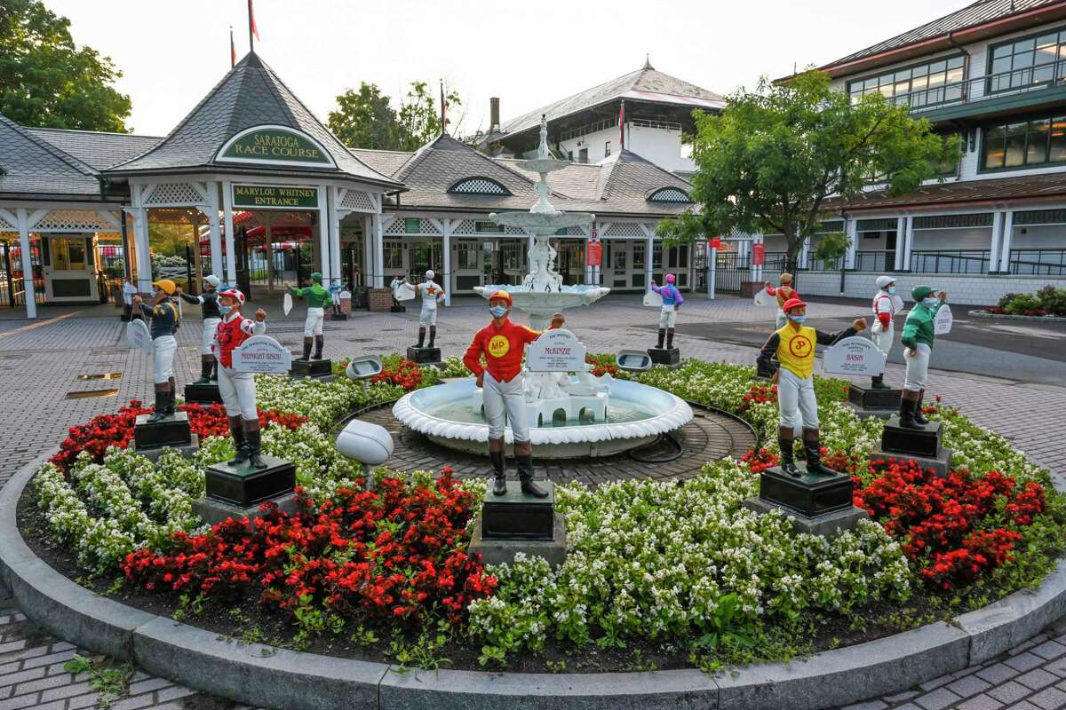 Even the lawn jockeys wear their masks are maintain social distancing outside the Clubhouse the day before opening day at Saratoga Race Course July 15, 2020 in Saratoga Springs, N.Y. Photo by Skip Dickstein/Special to the Times Union.