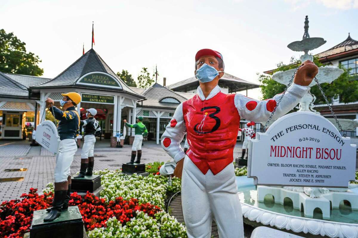 Even the lawn jockeys wear their masks are maintain social distancing outside the Clubhouse the day before opening day at Saratoga Race Course July 15, 2020 in Saratoga Springs, N.Y. Photo by Skip Dickstein/Special to the Times Union.