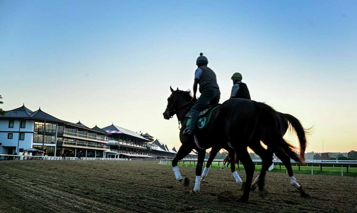 An exercise rider watches as horses gallop in the early morning the day before opening day at Saratoga Race Course July 15, 2020 in Saratoga Springs, N.Y. Photo by Skip Dickstein/Special to the Times Union.
