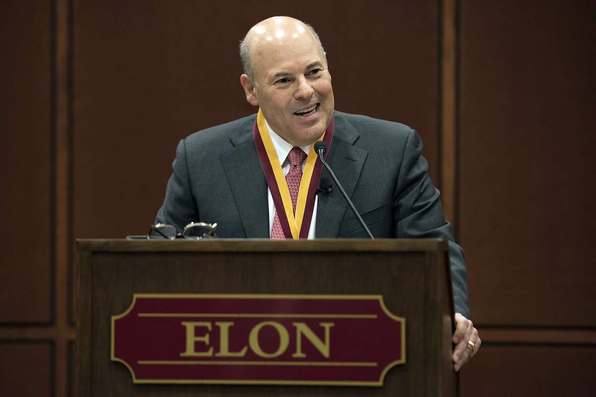 FILE - In this March 1, 2017, file photo, Elon Trustee Louis DeJoy is honored with Elon's Medal for Entrepreneurial Leadership in Elon. N.C. Mail deliveries could be delayed by a day or more under cost-cutting efforts being imposed by the new postmaster general, DeJoy. The plan eliminates overtime for hundreds of thousands of postal workers and says employees must adopt a ” different mindset” to ensure the Postal Service’s survival during the coronavius pandemic. (Kim Walker/Elon University via AP, File)