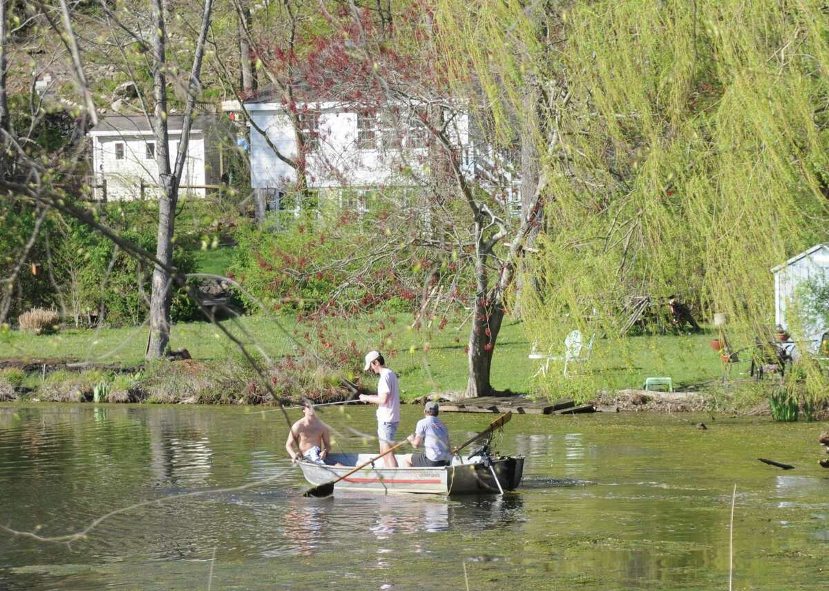 A cove on Rainbow Lake had some muck but fairly clear water when these boys were fishing early May.