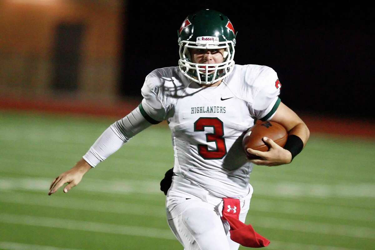 The Woodlands quarterback Lance Miles carries the ball during the game against Klein Collins Friday at Turner Stadium in Humble. See more photos online at www.yourconroenews.com/photos.