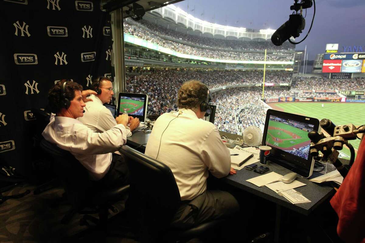 John Flaherty, Paul O?Neill and Michael Kay (left to right) in YES broadcast booth at Stadium.