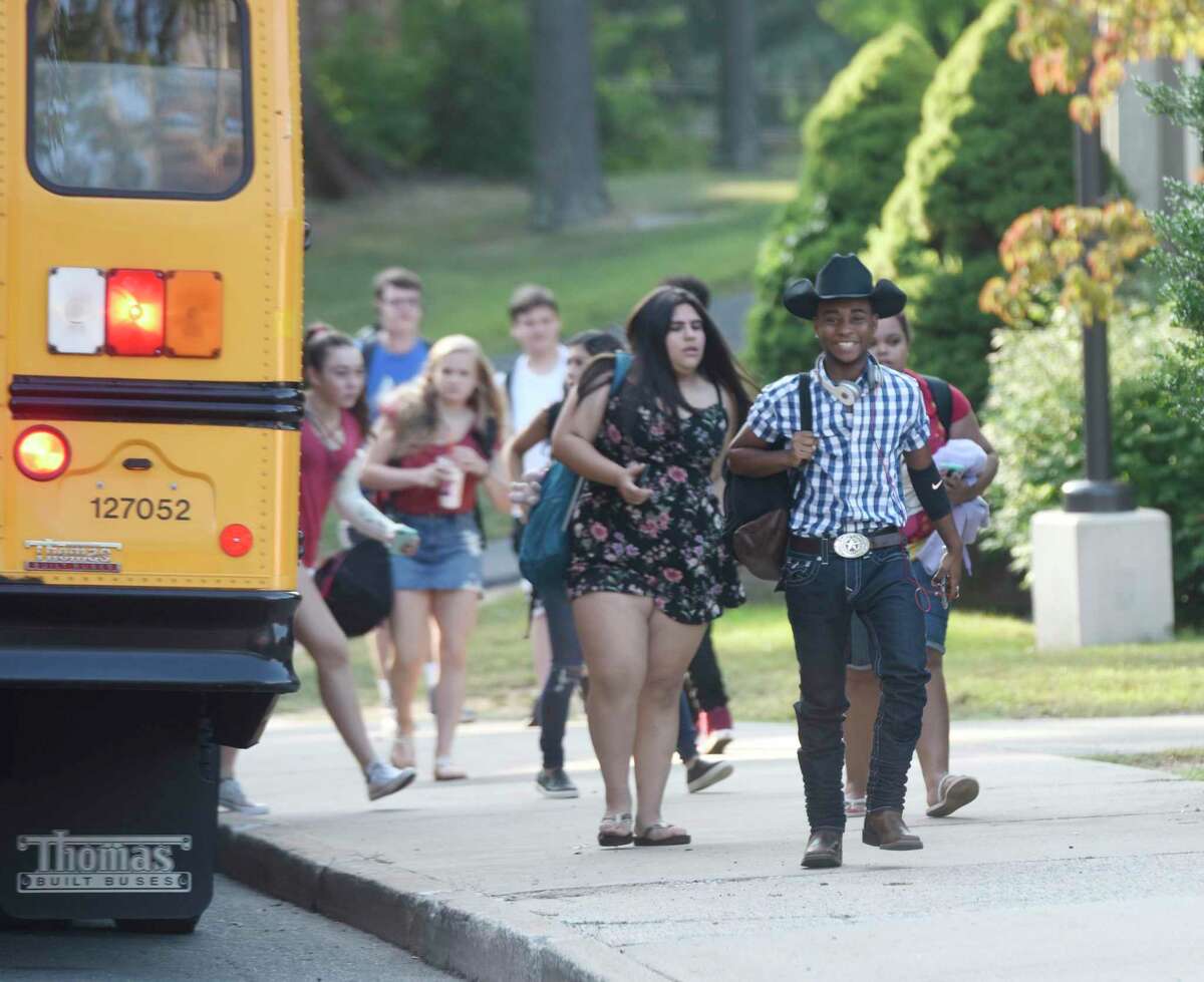 Students walk into school on the first day of the 2017-2018 school year at Greenwich High School in Greenwich, Conn. Thursday, Aug. 31, 2017.