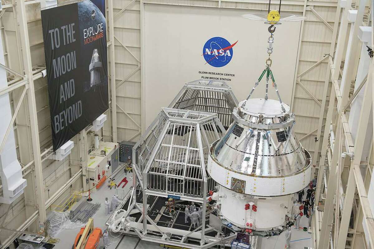 NASA’s Orion spacecraft is being lifted into a thermal cage and readied for its move into the vacuum chamber at NASA’s Plum Brook Station for testing. Testing includes a 60-day thermal test, where the spacecraft is subjected to temperatures ranging from -250 to 300 degrees Fahrenheit to ensure it can withstand the harsh environment of space during Artemis missions.