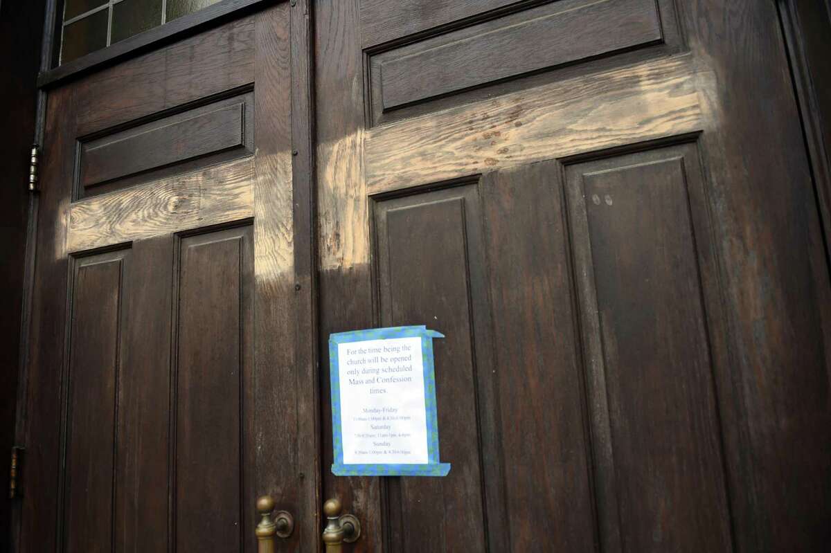 Satanic and anarchist symbols that were painted on the front doors of St. Joseph Church in New Haven have been removed on July 17, 2020.
