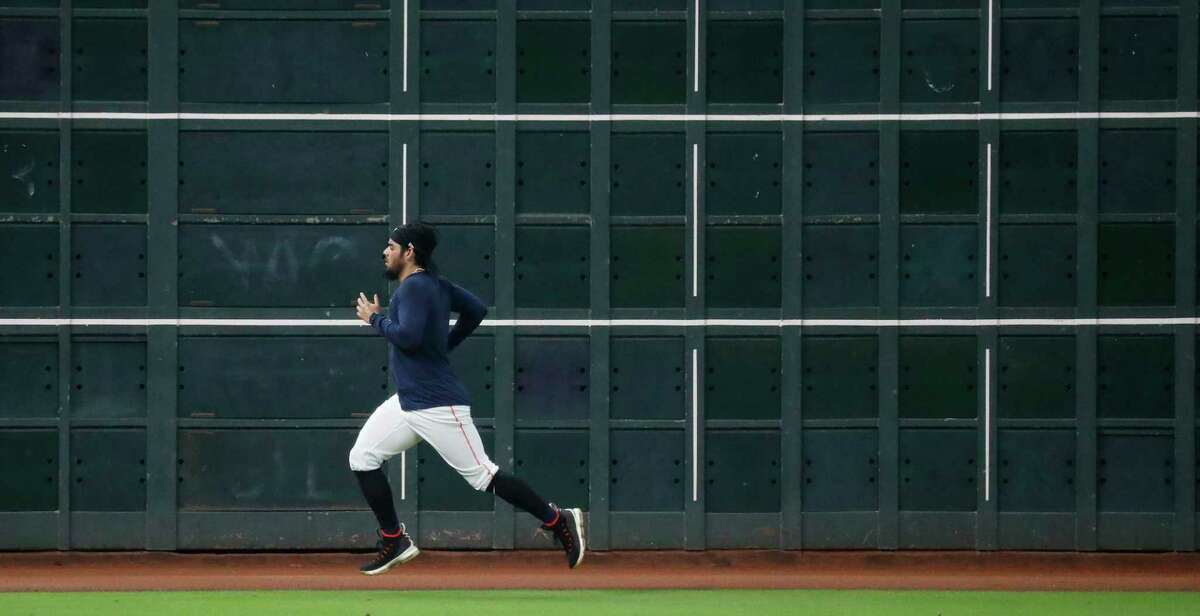 Houston Astros pitcher Roberto Osuna runs sprints in the outfield during the Astros summer camp at Minute Maid Park, Friday, July 17, 2020, in Houston.