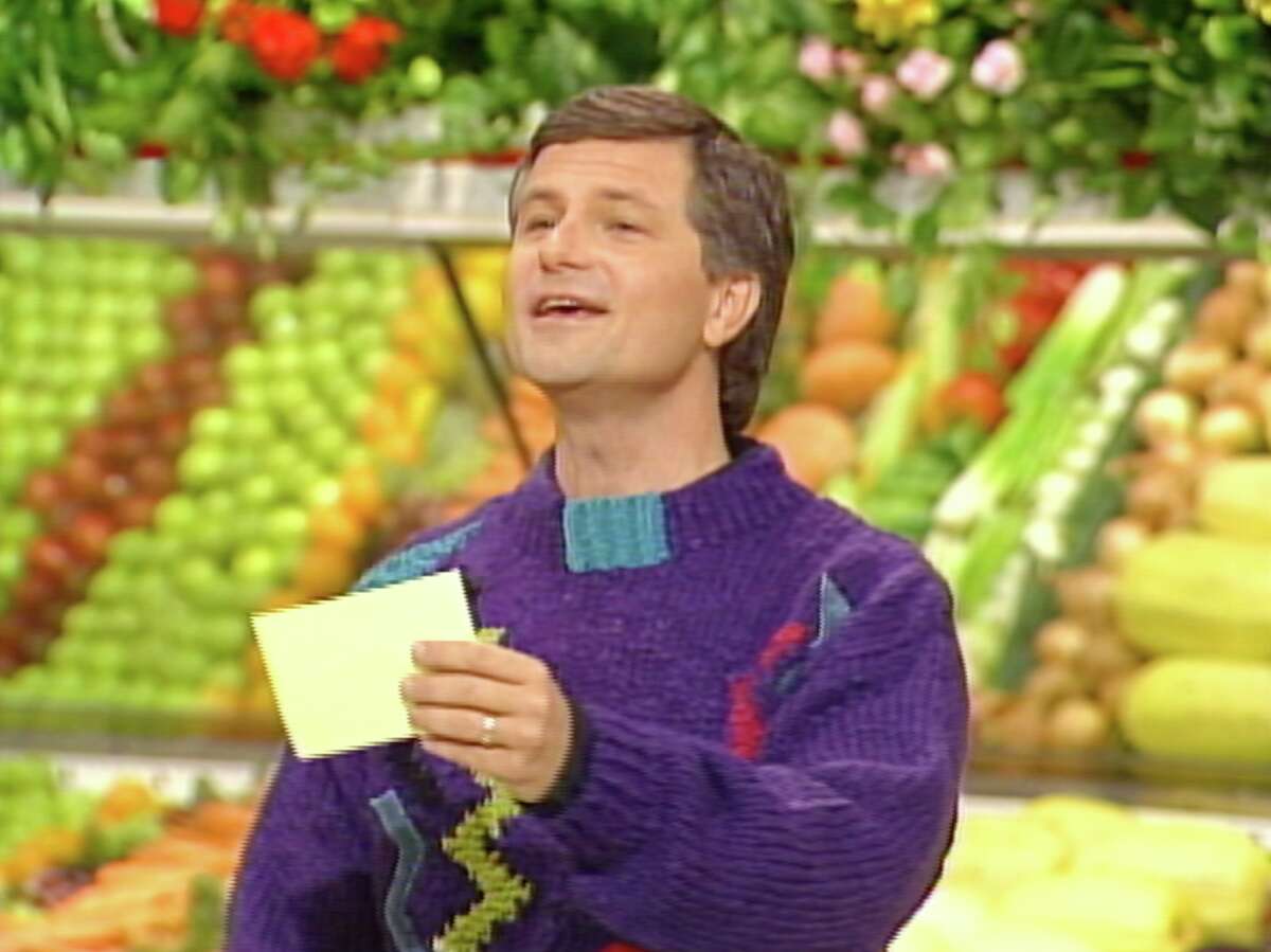 “Supermarket Sweep” host David Ruprecht poses in front of fake vegetables. He was also known for his excellent fashion sense on the show.
