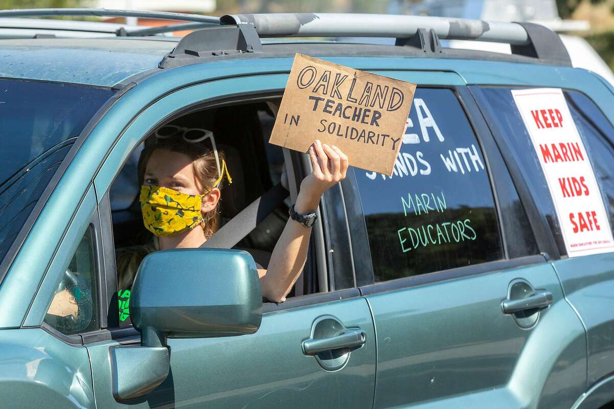 Shelby Ziesing in a car caravan protest outside the Marin County Office of Education on Thursday, July 16, 2020, in San Rafael, Calif. Teachers and their supporters across California are protesting school district plans for in-person learning, amid the coronavirus pandemic.