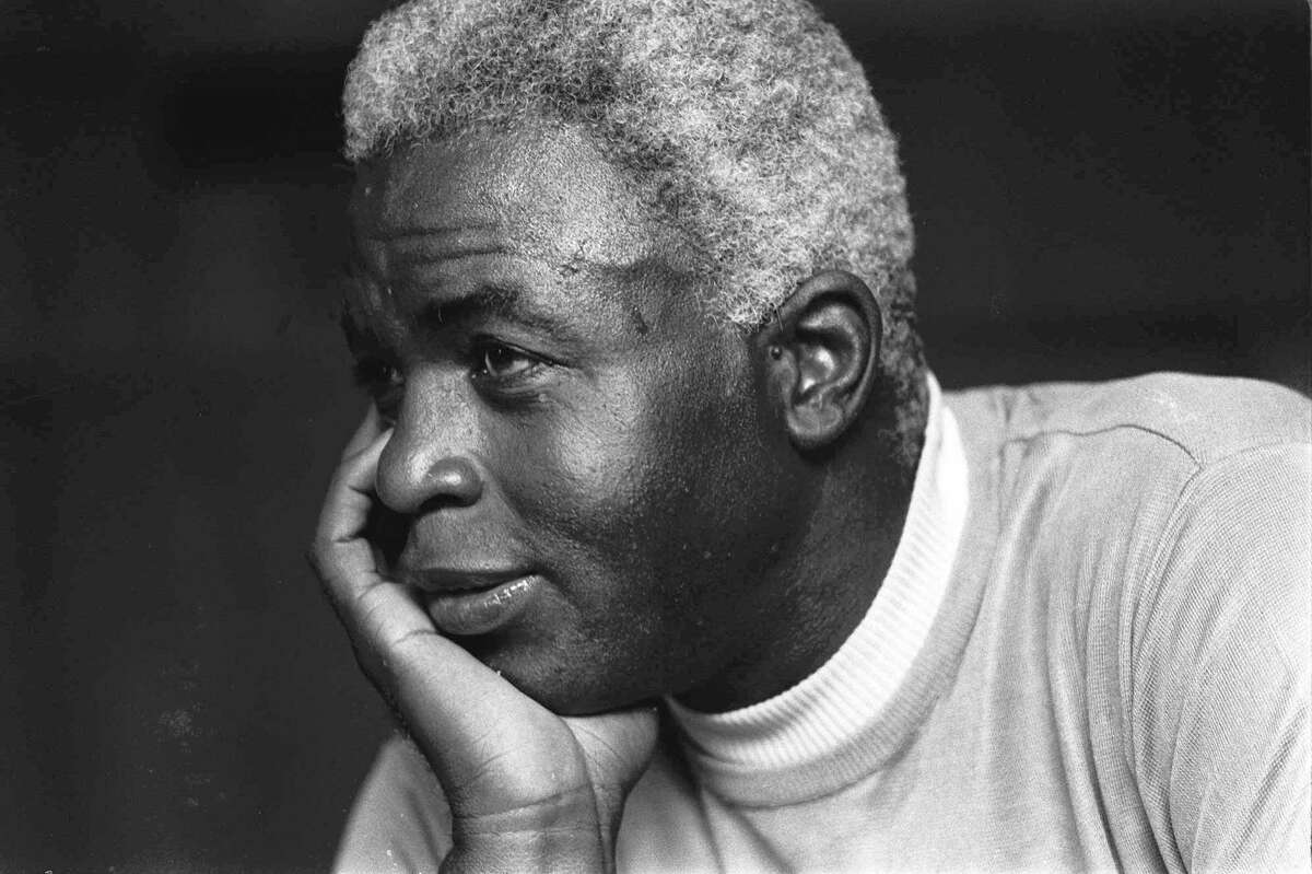 In this June 30, 1971 file photo, Jackie Robinson poses at his home in Stamford, Conn.
