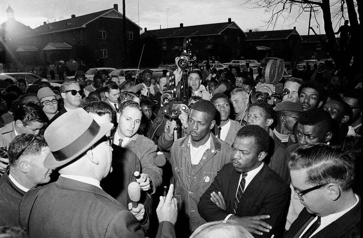 Wilson Baker, left foreground, public safety director, warns of the dangers of night demonstrations at the start of a march in Selma, Ala. Second from right foreground, is John Lewis of the Student Non-Violent Committee. Lewis, who carried the struggle against racial discrimination from Southern battlegrounds of the 1960s to the halls of Congress, died Friday,