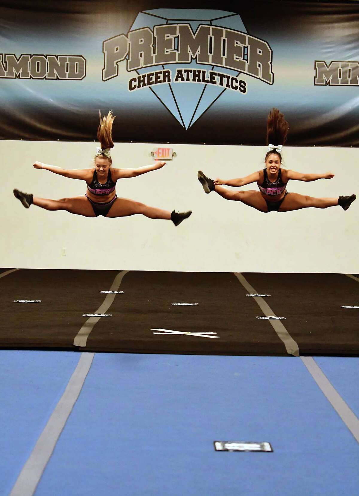 Alex Joslyn, 15, of Latham, left, and Miranda Diaz, 14, of Albany, practice during tryouts for the group's hip-hop competitive team at Premier Cheer Academy on Friday, July 17, 2020 in Albany, N.Y. (Lori Van Buren/Times Union7